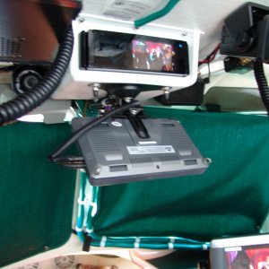 Media 'The monitor can also swivel to be viewed from the v-berth.' in album 'Top center is a JVC CD/DVD/HD Radio with 3.5", below is a 7" monitor, on the dash is the Garmin 5208. Left of center is a Radio Shack CB and to the right is a West Marine DSC/VHF. To the right of the Garmin is a Uniden hand held GPS/VHF backup. Very top center is sensor for alarm system.'
