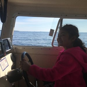 Mia at the helm