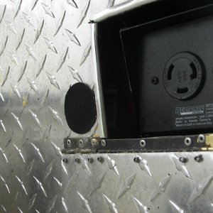 Media 'This is where I plug in the boat's shorepower, twist-lock plug.  The flap protects from rain.' in album 'Everybodys' dream!  A Tractor Supply box on your C-Dory!'