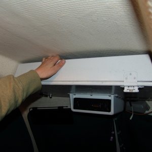 Media 'Easy to open and close. Bolts to roof using one bolt from top rail on each side and one additional bolt on each side.' in album 'Simple overhead shelf made of plywood.'
