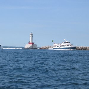 Ferrys rounding harbor entrance to Mackinac Island Harbor