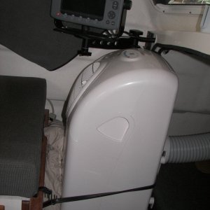Cushioned with pillow, bungied to seat rail and E-80 bracket. Ground fault interrupter came built-in. 965 Watts,8.5 amps running, 15.3 amps start, delayed rotary compressor.
