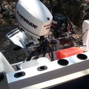 Media 'Strap at bottom is the trailer strapover hold down. This thing Pole bar was $20 on e-bay(*plus $36 shipping and $30 mounting hardware, such a deal)' in album 'New starboard rod rack/cup rail brings splash well up 8" Room for 6 rods/3 cupholders and 2 net holders across back.'