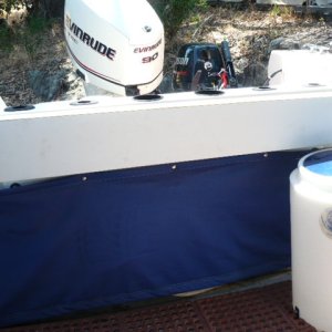Starboard rail gives an illusion of safety from raised aft freeboard but somewhat at a cost of lesser ease of outboard access. Will build removable Starboard fish cleaning/serving table to fit rail.