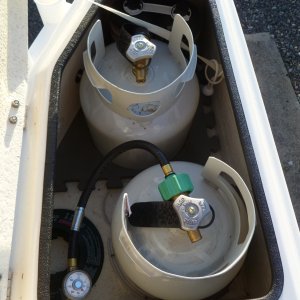 two tanks fit nicely in the old style lazerets, fumes drain out through hull