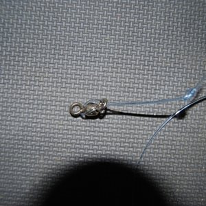 stick loop through and around hardware, makes it quick to swap out rigs & hooks