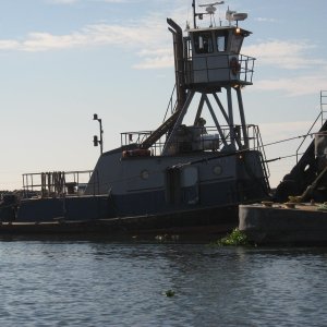 tow boat and barge dredging