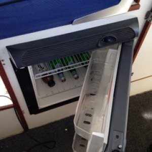 Refrigerator under helm seat