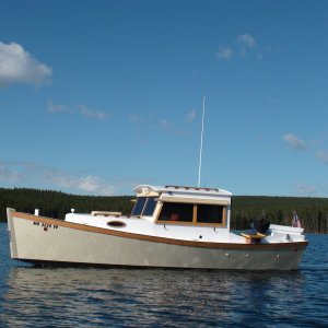 Media 'Paul who Captains the Queen built this boat' in album 'Mama Grizz & cubs along road very near Coulter Bay, Jackson Lake on our way to Yellowstone Lake.'