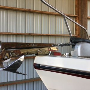 Pivoting bow roller and anchor safety strap