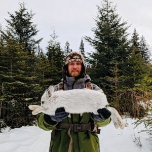 Dr. Mike Sturm with the biggest Snowshoe Hare I have ever seen.