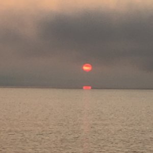 Sun peeking through the smoke, 05:00 7-7-19 Kachemak Bay AK.