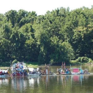 Miss Rockaway (dumpster diver raft, 2 VW diesels, and about 20 hippies), on the way to St. Louis, MO. on Old Man River. It's 80 feet long. Google up "Miss Rockaway" and click on "Blog" for more info.