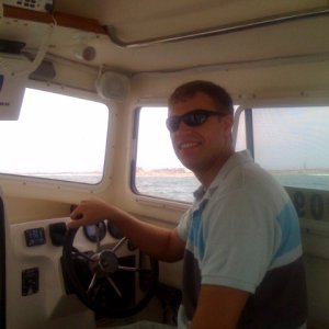 My son, John, at the helm