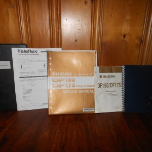 Media 'Dec 2013:  Detailed systems binder, upgraded Teleflex steering system receipt, Suzuki 150 'shop manual' ($60 value), engine quick reference guide, and log book with adventures and all service receipts.' in album 'Stb side picture from Eel Pond in Wood's Hole Oct 2013.  Beautiful last cruise!'