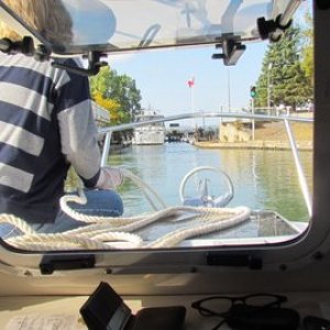 Coming up on a lock. These locks are mostly tended by girls who crank the lock doors open and closed by hand. They also manually open and close the water gates to fill or drain the locks