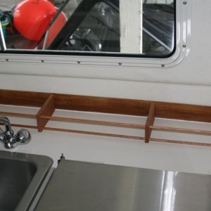 Media 'Galley rack' in album 'Inspired by others - galley rack made with 2 1/2" wide oak with two 3/8" dowels running the length.'