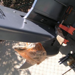Clamped on each side, drilling holes, notice bag over prop spindle to avoid shavings.