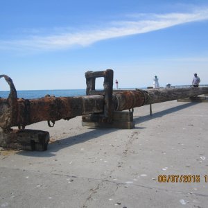 This is the 200 year old mast caught in a fishing net off the tip of Long Point(Lake Erie) in early May 2015. It is 77 feet long - 15 to 20 inches in dia. - solid pine and weighing(waterlogged) between 15 and 20 tons. This is the day it was put back in the water as ordered by the Ontario government.