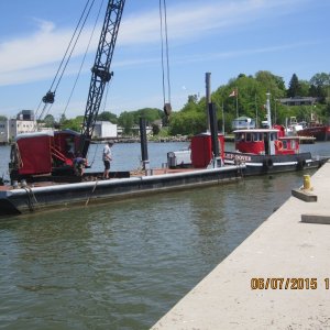 This barge and tug worked pretty slick. The post on each side of it could be lowered into the water up to 20 feet to push into it and hold the barge in place.