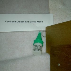 (Lynn Marie) Carpet edge at rope locker with wood trim locker bulkhead extender.