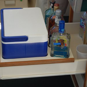 (Minnie Swann) Top drawer is ice bucket and liquor cabinet