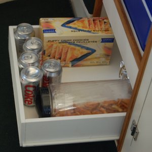 (Minnie Swann) Bottom drawer is for snacks and mix.