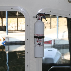 Fire extinguisher installed on port side of rear door - used the screw from the window frame.