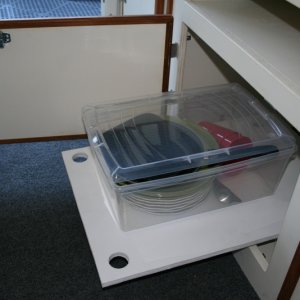 Extending shelf below aft dinette seat cabinet.