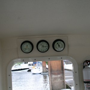 Media 'My "weather station" mounted above the cabin door - Weems & Plath Barometer, Clock and Tide Clock (Nightwatch in black finish)' in album 'Fire extinguisher installed on port side of rear door - used the screw from the window frame.'