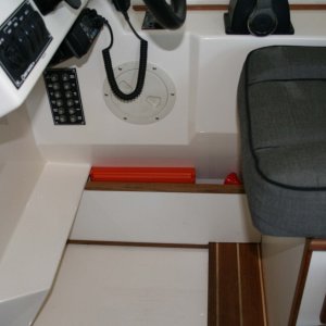 Media 'Another idea 'borrowed' from others - divider beneath the helm seat creates great space for flare kit, etc.' in album 'Fire extinguisher installed on port side of rear door - used the screw from the window frame.'