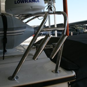 Media 'Smith ss rod holders added to radar arch' in album 'Fire extinguisher installed on port side of rear door - used the screw from the window frame.'
