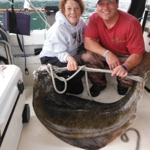 Hog tied Halibut and happy fishermen