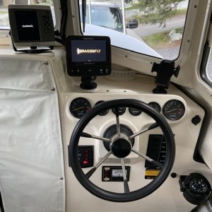 Media 'Reconfigured dash with compass down low, two chart plotters, and phone mount' in album 'Cleaned up new boat'