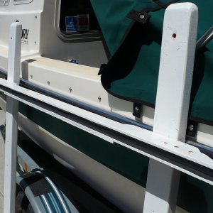 Cut grove on the table saw. Added the foam to protect the rail then tied it on. Simple, cheap and recycleable.