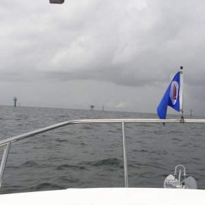 Seabrook Marina Burgee and oil rigs about 10 miles offshore. Tons of ships, rigs and things that go bump in the night off Galveston, TX.