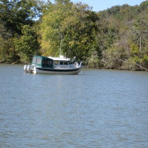 Rich on Sandpiper putting out anchor for us to raft up on the Harpeth River