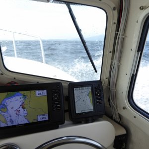 Crossing the normally nasty Bellingham Bay Sunday morning. Took a couple of waves over the bow, a first for me in the 22!