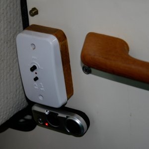 Kenwood-Remote-Control is velcro mounted under the Shakespeare Skywatch TV amplifier box on the forward port bulkhead.