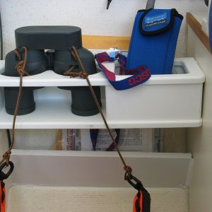 (Not For Hire) Binocular rack etc. at helm. Lower piece along with the back of binocular rack makes a chart, and manual rack.