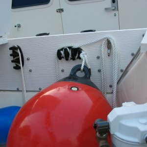 (Not For Hire) Wave barrier board shelf from stern showing handy z-grip cleat to hold fenders in place, etc.