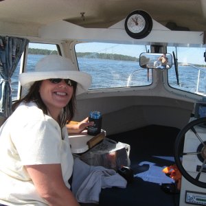 Media 'Cruising the ICW from Panama City to Destin' in album 'Inside, The added upper storage shelf w/tide clock is great for charts and misc. items. a lockable storage compartment under the helm seat, great for storing electronics etc.A Garmin 440 s Chartplotter and West Marine Windshield washer, much needed!'