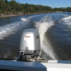 Media '30 mph on ICW' in album 'Inside, The added upper storage shelf w/tide clock is great for charts and misc. items. a lockable storage compartment under the helm seat, great for storing electronics etc.A Garmin 440 s Chartplotter and West Marine Windshield washer, much needed!'