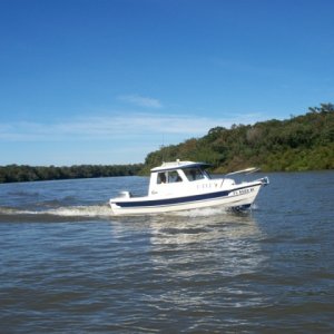 Media 'Cruising Appalacheecola River C-Dory gathering' in album 'Inside, The added upper storage shelf w/tide clock is great for charts and misc. items. a lockable storage compartment under the helm seat, great for storing electronics etc.A Garmin 440 s Chartplotter and West Marine Windshield washer, much needed!'