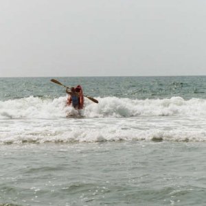 Kathy riding waves at Ocracoke, NC