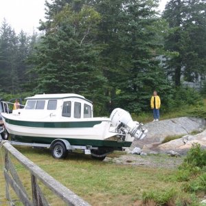 Launching the Otter on unimproved home launch site on Horseshoe Cove, Brooksville, ME
