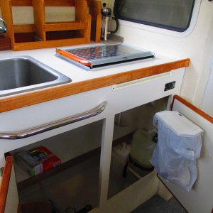 Lots of storage under sink and stove.