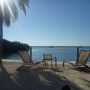 To the left is an Island called Pretty Joe Rock. They rent it for about 4k a week. comes with boat has a lot of nice amenities, hot tub etc. nice sunsets