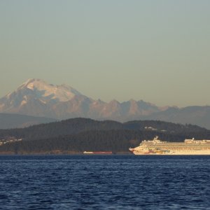 Sun setting on Mount Baker and a passing cruise ship