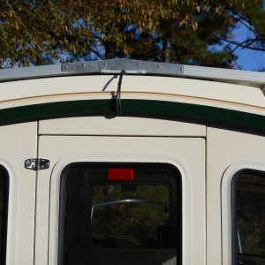 I made the frame mounts to match the slight roundness of the roof and to shed water. I used readily available aluminum stock and SS hardware.
